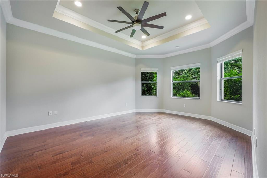 4609 Azalea Drive Naples, FL 34119 - Photo 21 of 45 wooden floor in an empty room with a window