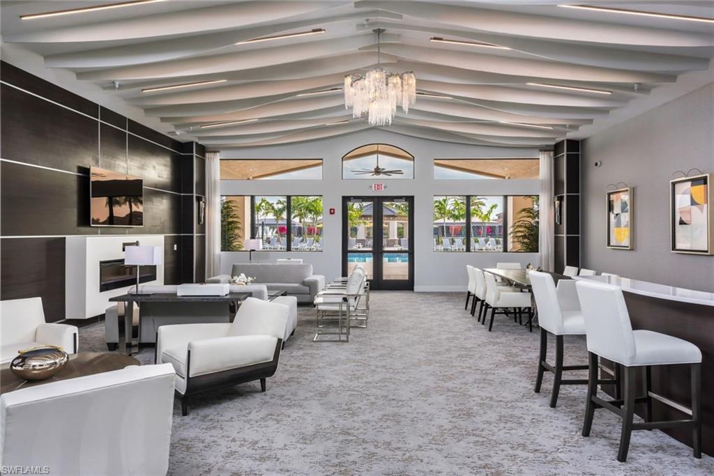 4609 Azalea Drive Naples, FL 34119 - Photo 35 of 45 a living room with furniture and a large window