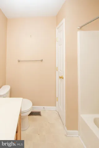 a view of a house with a wooden deck