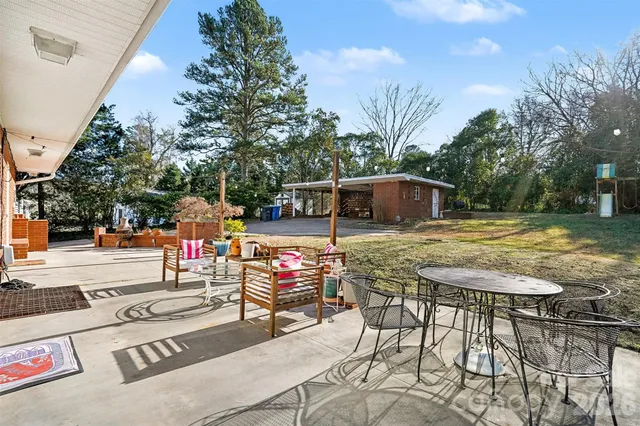 a view of a swimming pool with a patio