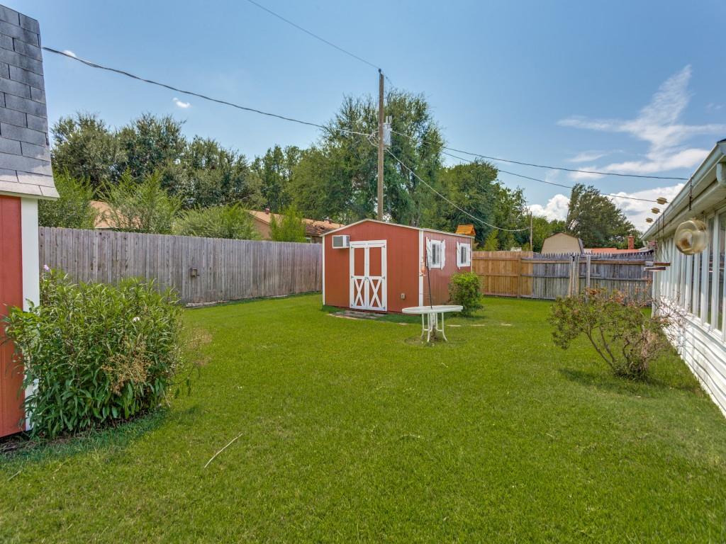 1216 Manning Street Benbrook, TX 76126 - Photo 24 of 26 Fenced backyard with a shed