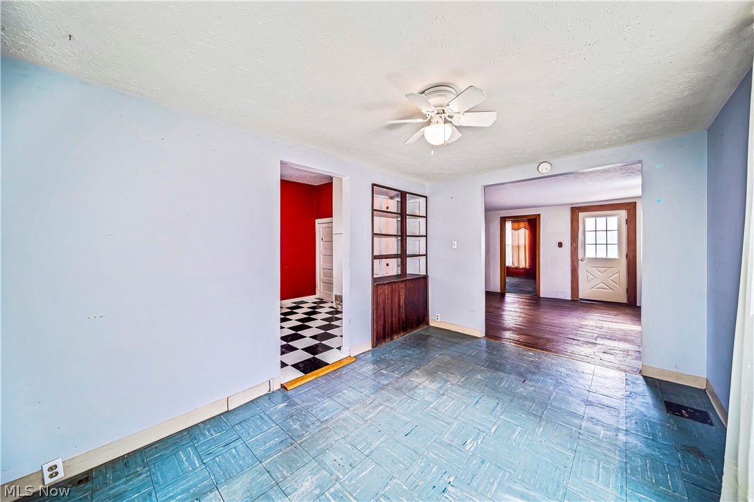 116 South Cedar Street Geneva, OH 44041 - Photo 7 of 35 Dining room featuring ceiling fan and dark tile floors
