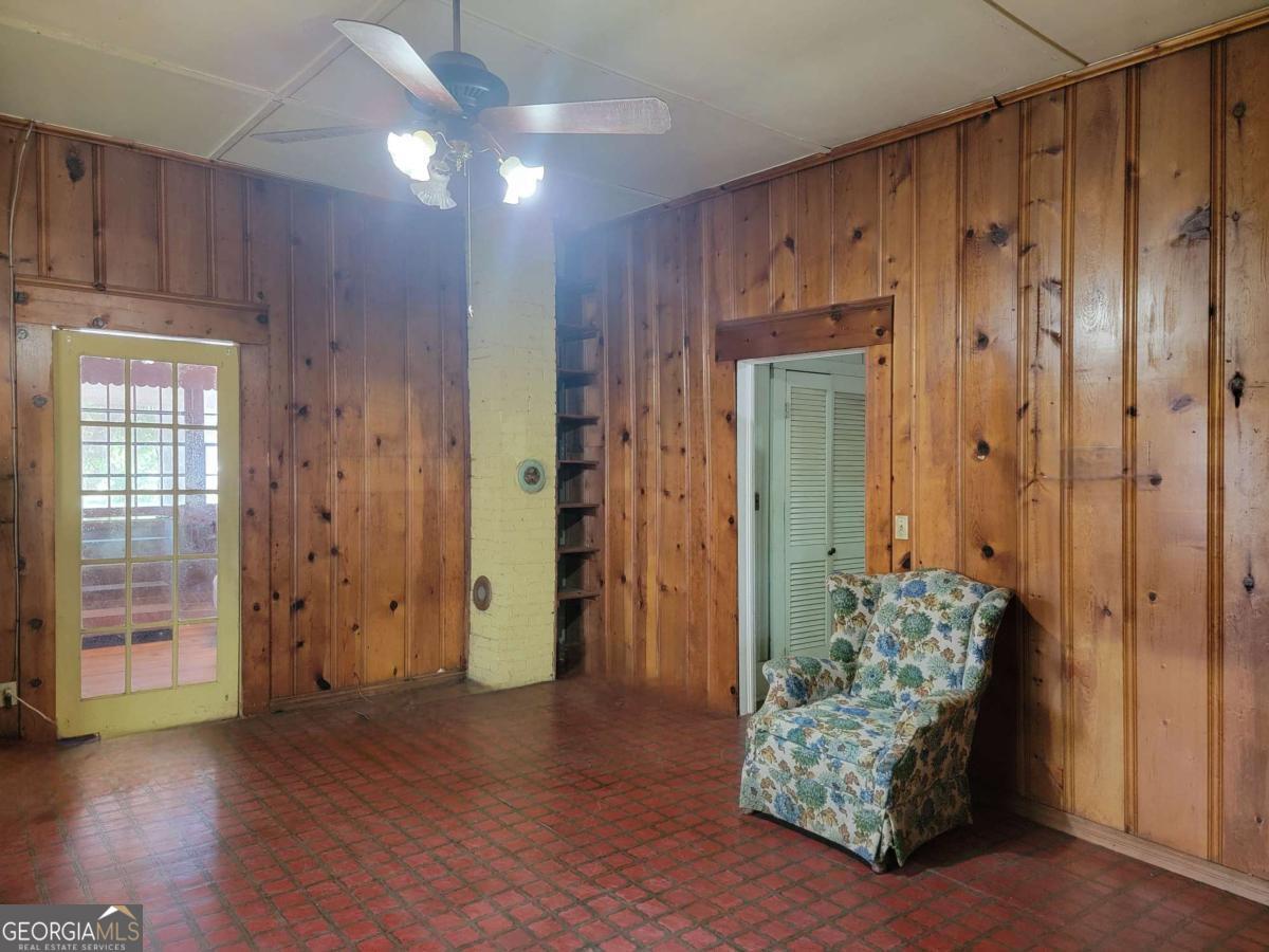 346 South Oliver Street Elberton, GA 30635 - Photo 23 of 52 a view of livingroom with hardwood floor and a ceiling fan
