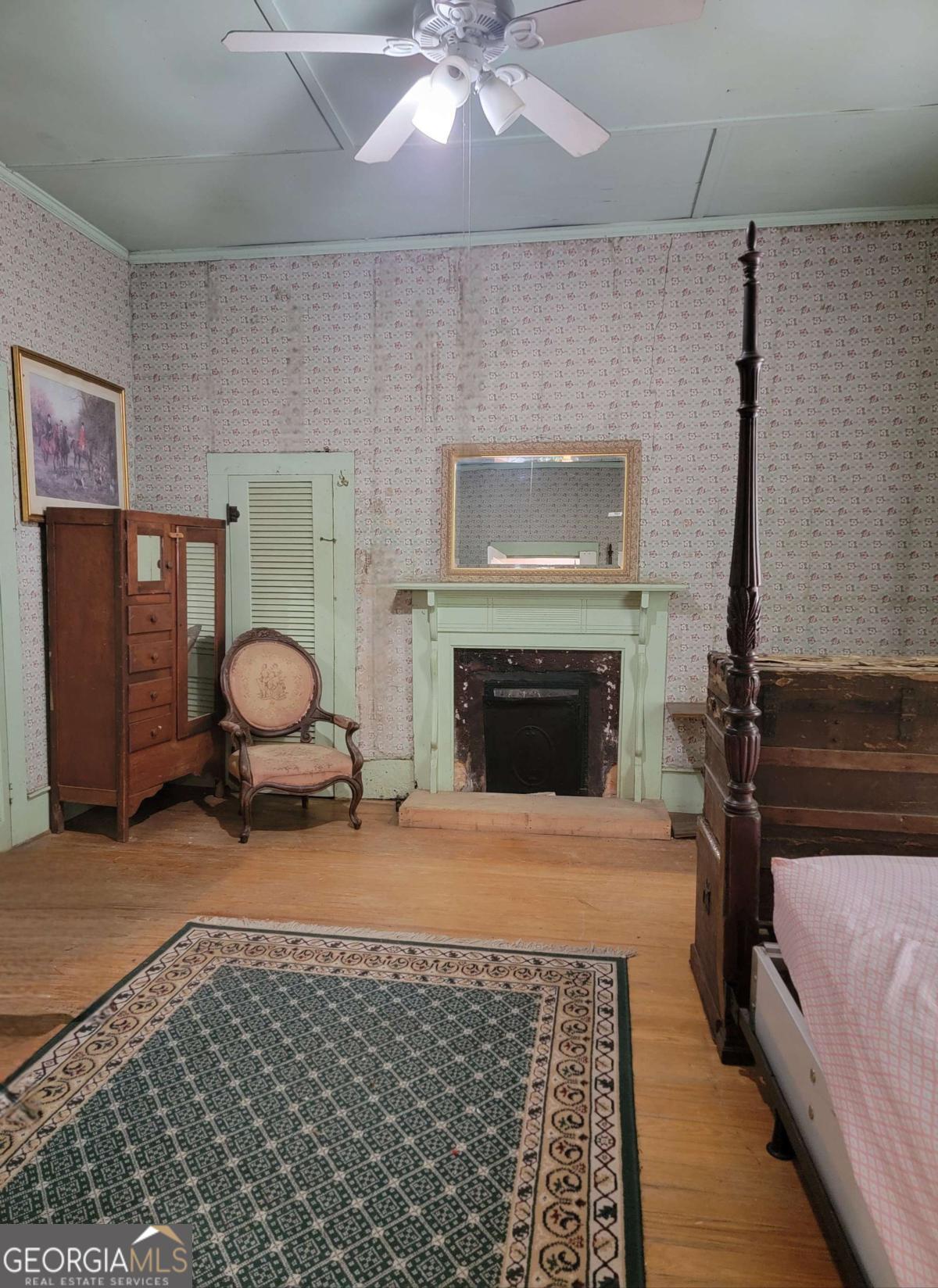 346 South Oliver Street Elberton, GA 30635 - Photo 27 of 52 a living room with furniture a rug and a fireplace