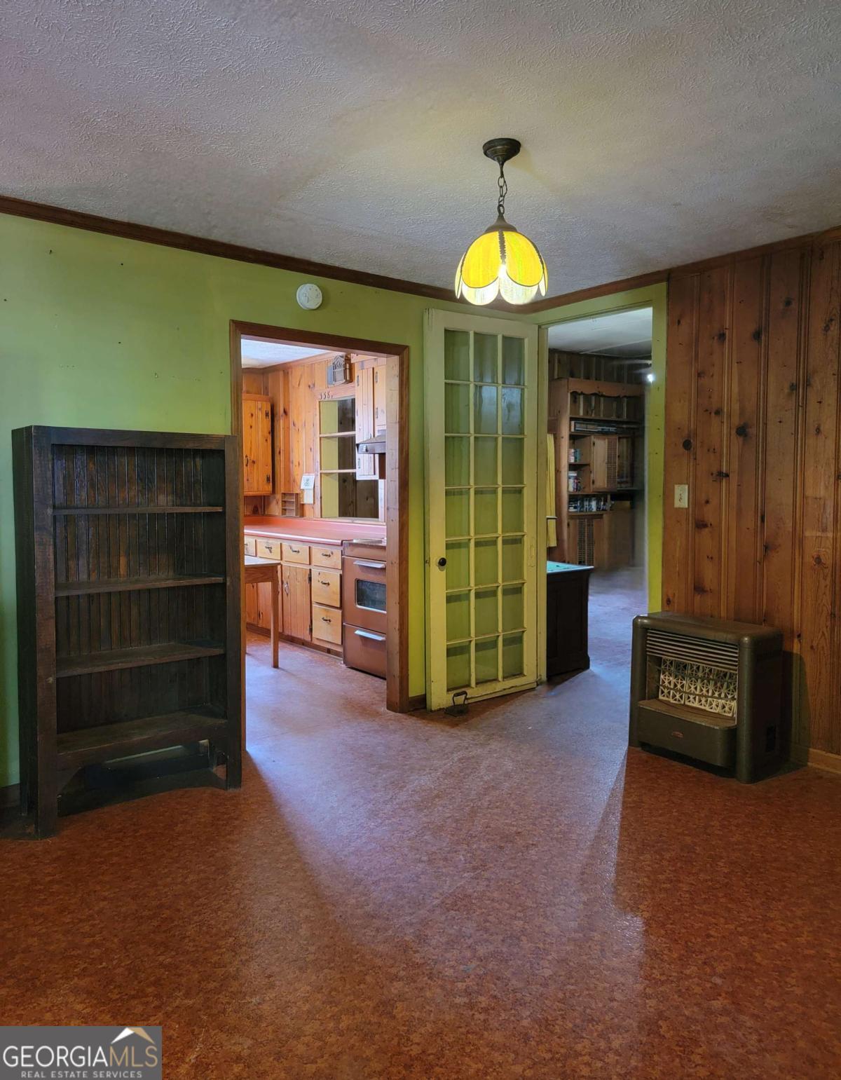346 South Oliver Street Elberton, GA 30635 - Photo 37 of 52 a view of an empty room with a fireplace and a window