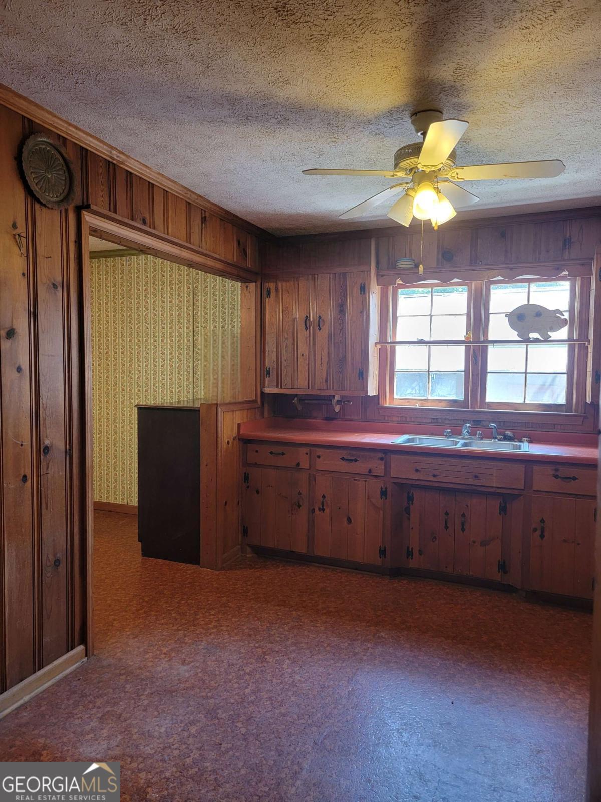 346 South Oliver Street Elberton, GA 30635 - Photo 41 of 52 a kitchen with granite countertop cabinets stainless steel appliances and a window