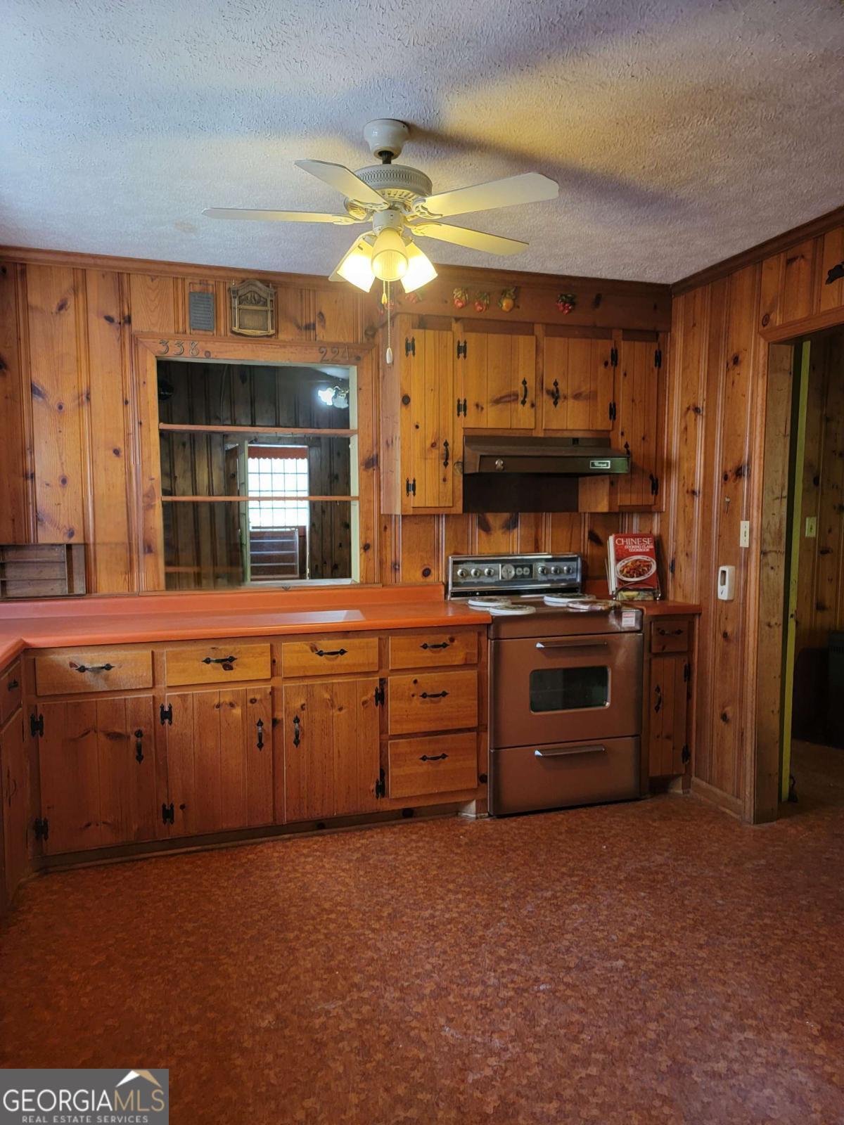 346 South Oliver Street Elberton, GA 30635 - Photo 42 of 52 a kitchen with stainless steel appliances granite countertop a stove and a refrigerator