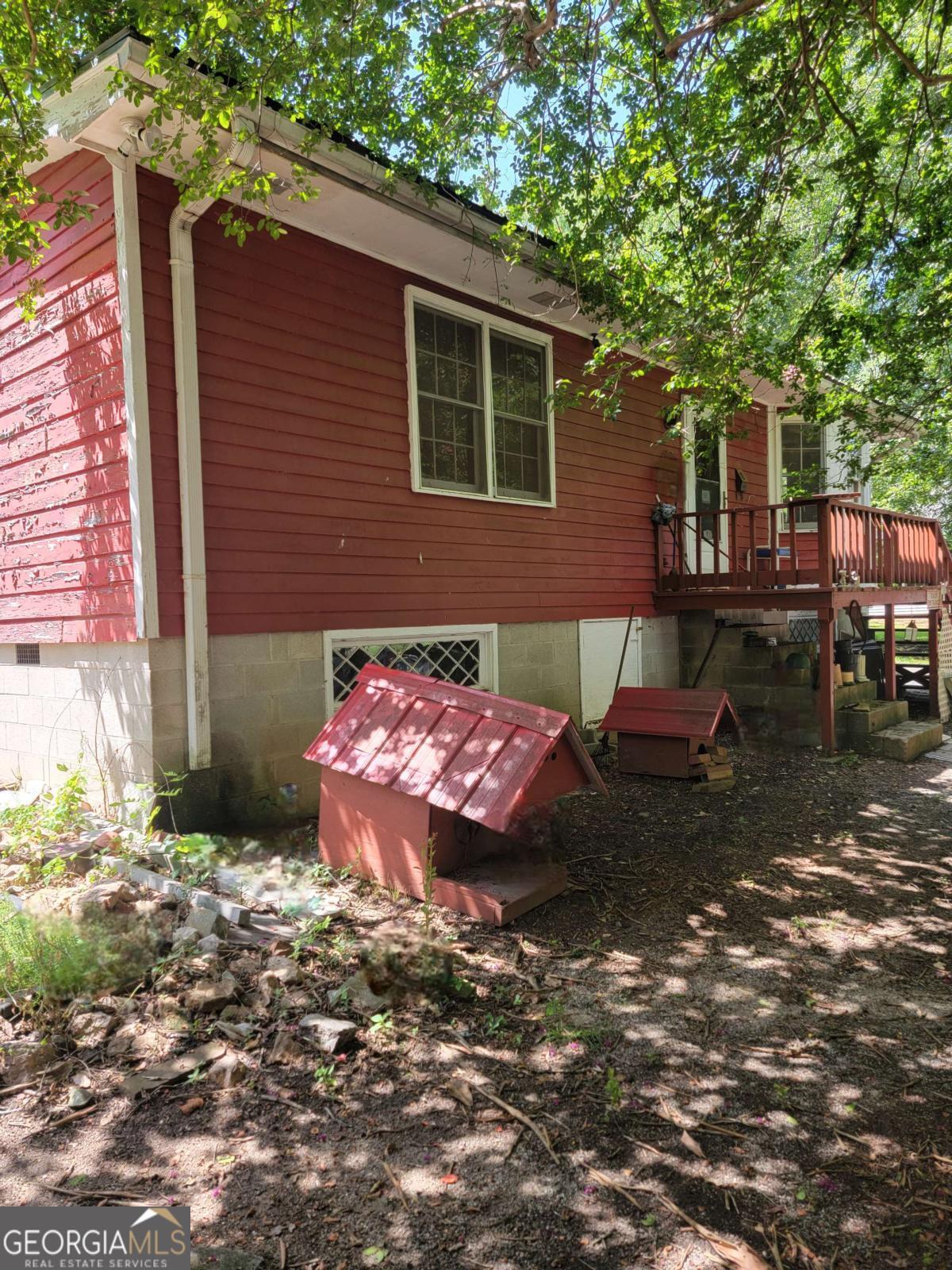 346 South Oliver Street Elberton, GA 30635 - Photo 45 of 52 a view of a backyard with table and chairs and wooden fence