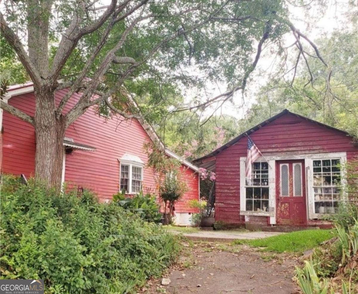346 South Oliver Street Elberton, GA 30635 - Photo 47 of 52 a view of a yard in front of a house with large tree