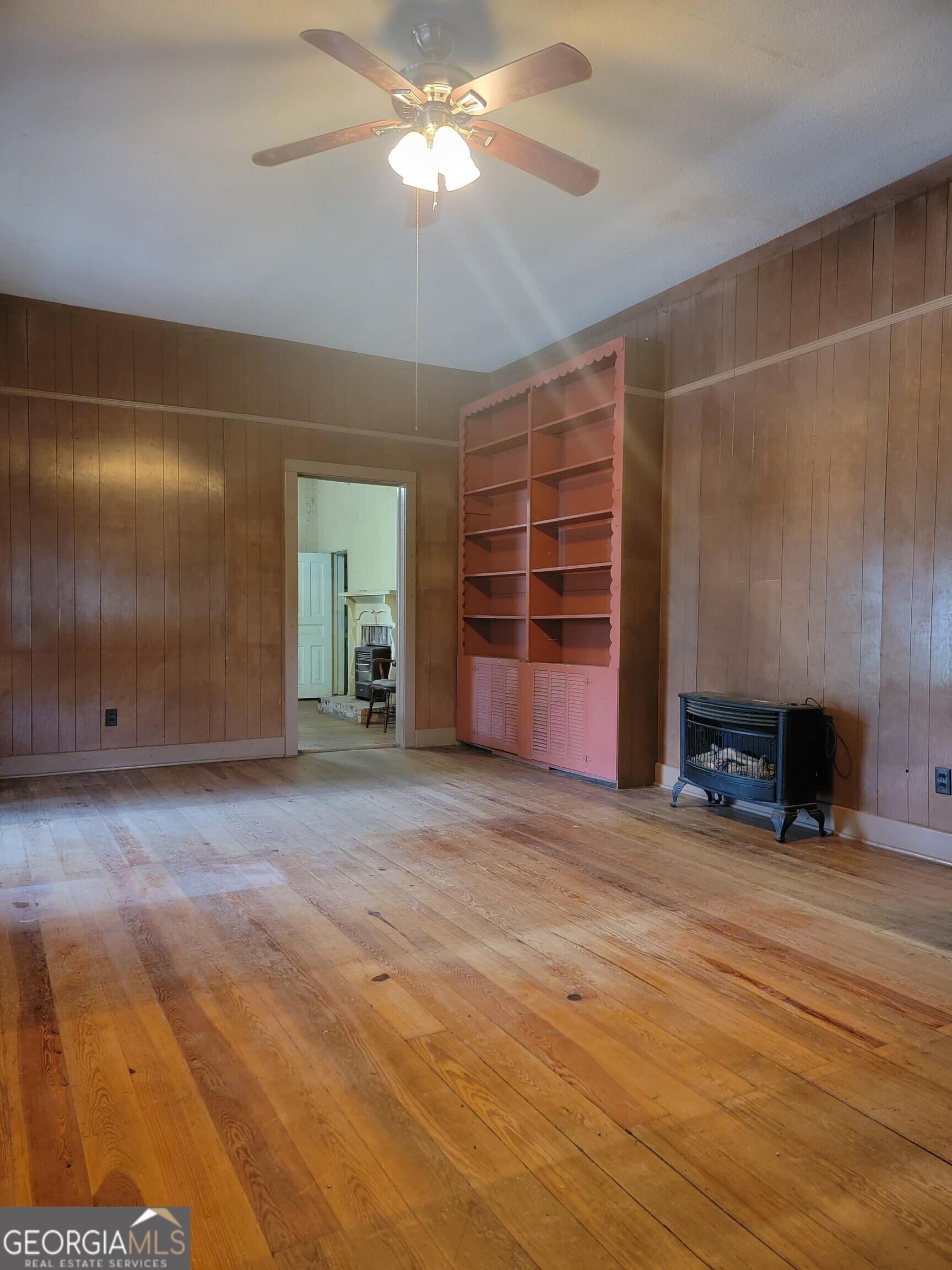 346 South Oliver Street Elberton, GA 30635 - Photo 7 of 52 a view of an empty room with a fireplace