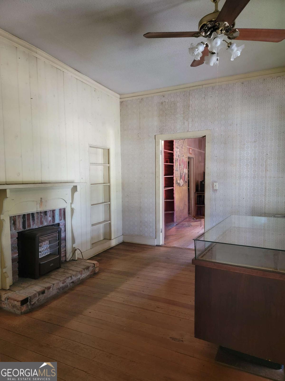 346 South Oliver Street Elberton, GA 30635 - Photo 10 of 52 a living room with furniture and a fireplace