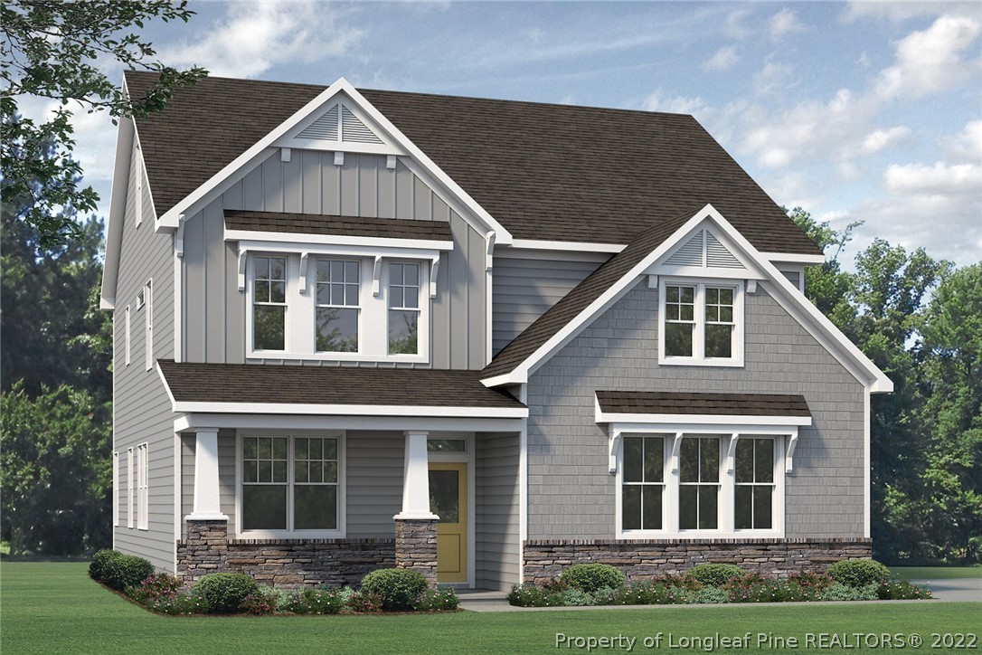 243 Rocking Horse Lane Raeford, NC 28376 - Photo 1 of 3 a front view of a house with garden