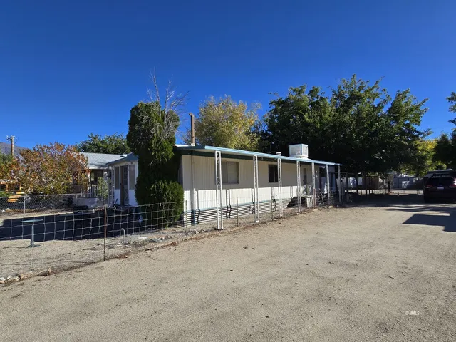 a view of a house with a fence