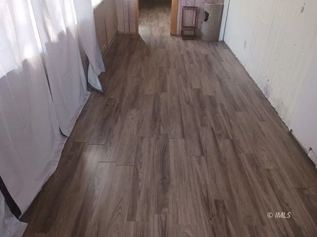 a hallway with wooden floor