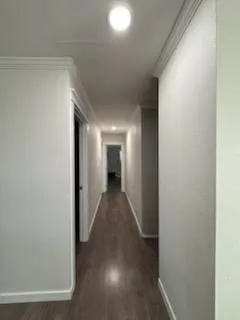 a bedroom with a bed and a night stand