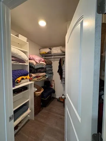 a bedroom with a bed and dresser