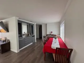 a very nice looking dining room with a table and chairs