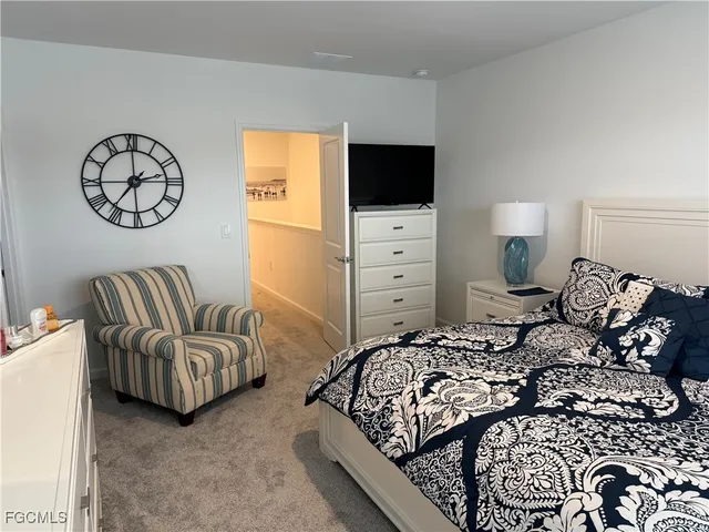 hallway view with wooden floor and staircase