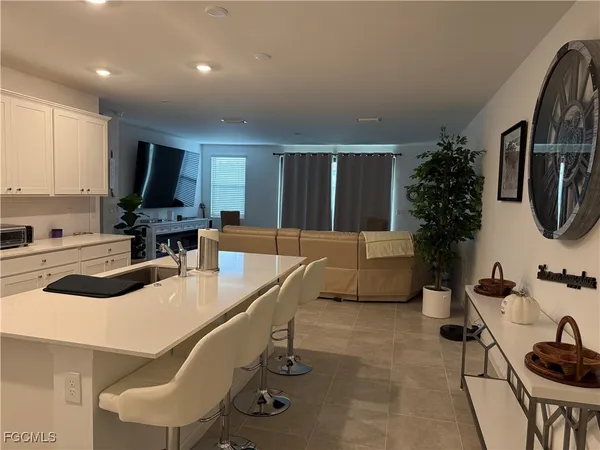 a kitchen with a sink cabinets and stainless steel appliances