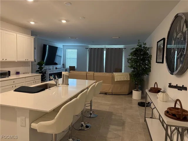 a kitchen with a sink cabinets and stainless steel appliances