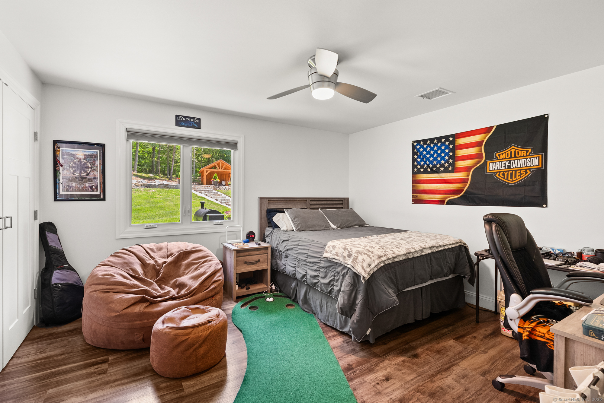 85 Good Hill Road Roxbury, CT 06783 - Photo 15 of 33 a bedroom with a bed and wooden floor