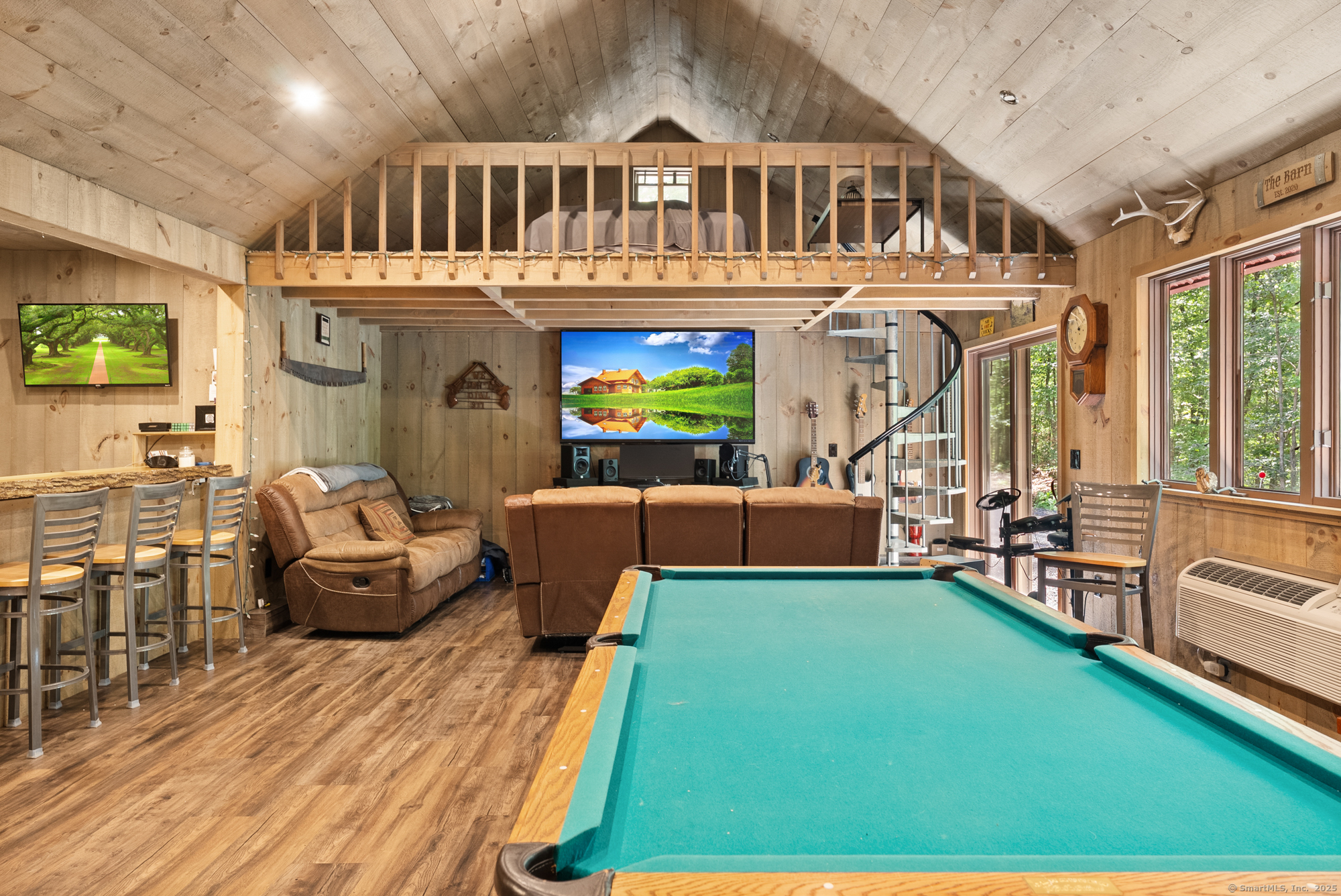 85 Good Hill Road Roxbury, CT 06783 - Photo 26 of 33 a living room with furniture floor to ceiling window and wooden floor
