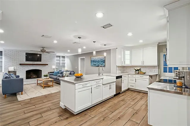 a kitchen with lots of counter top space and appliances