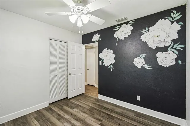 a view of a chandelier fan and entryway