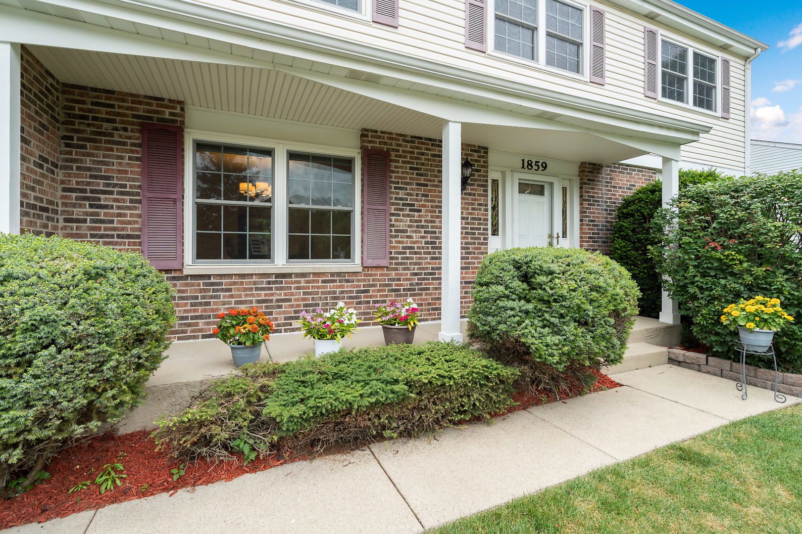 1859 Lisson Road Naperville, IL 60565 - Photo 3 of 32 a front view of a house with garden