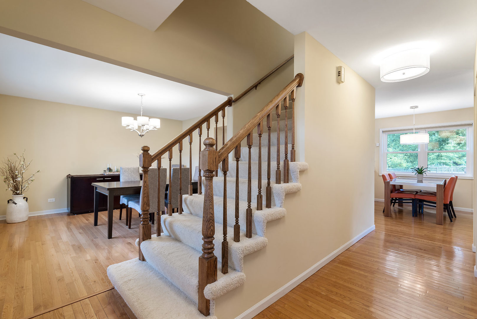 1859 Lisson Road Naperville, IL 60565 - Photo 5 of 32 a living room with furniture and a dining table with wooden floor