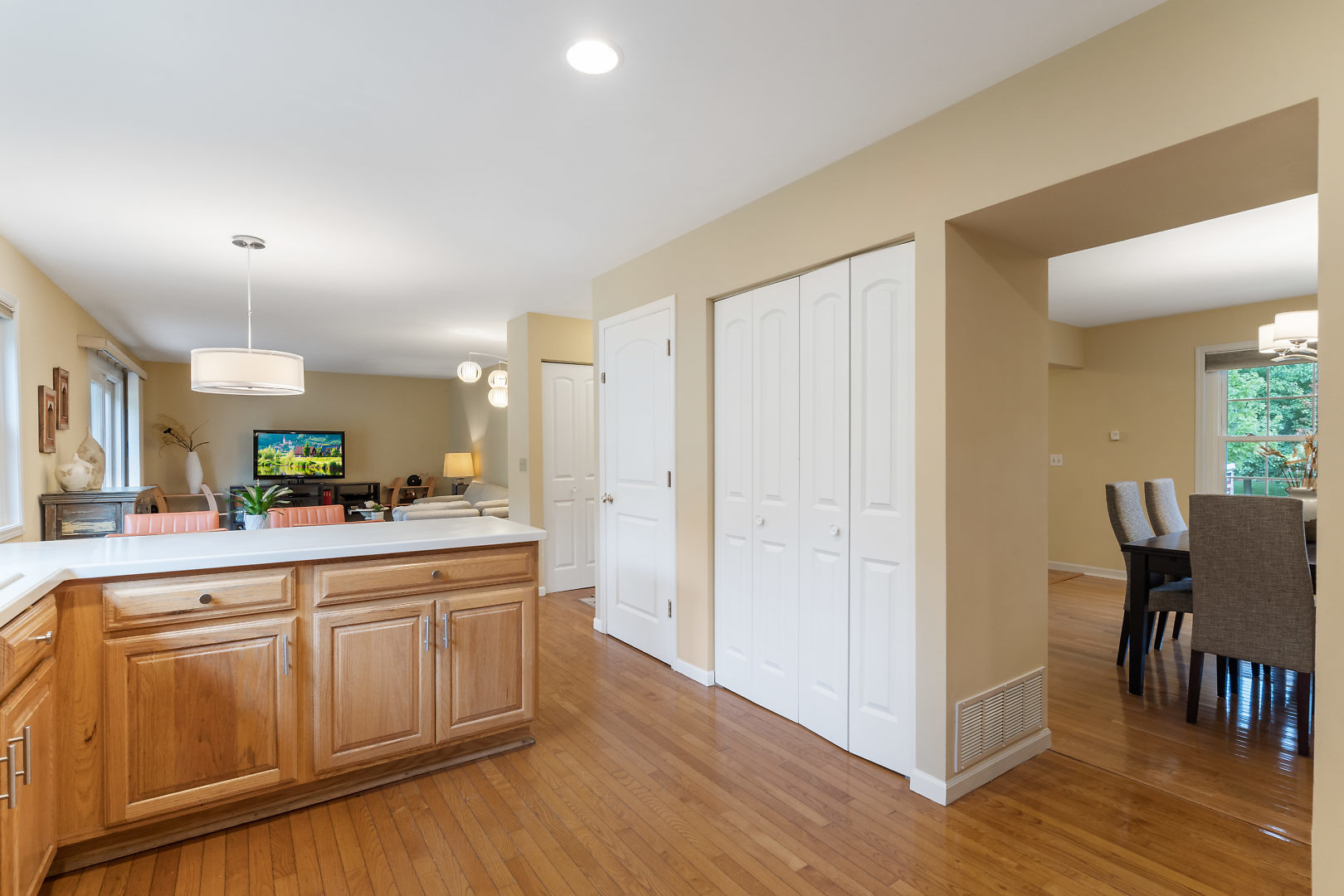 1859 Lisson Road Naperville, IL 60565 - Photo 8 of 32 a large kitchen with cabinets chairs and wooden floor