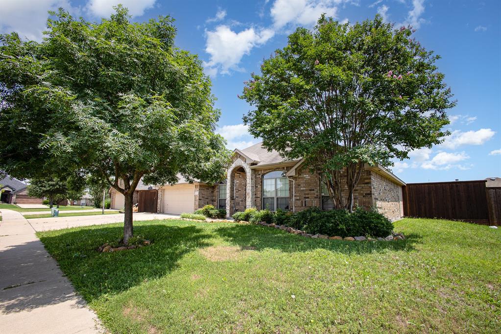 103 Hay Meadow Drive Crandall, TX 75114 - Photo 2 of 10 a front view of a house with a yard and tree