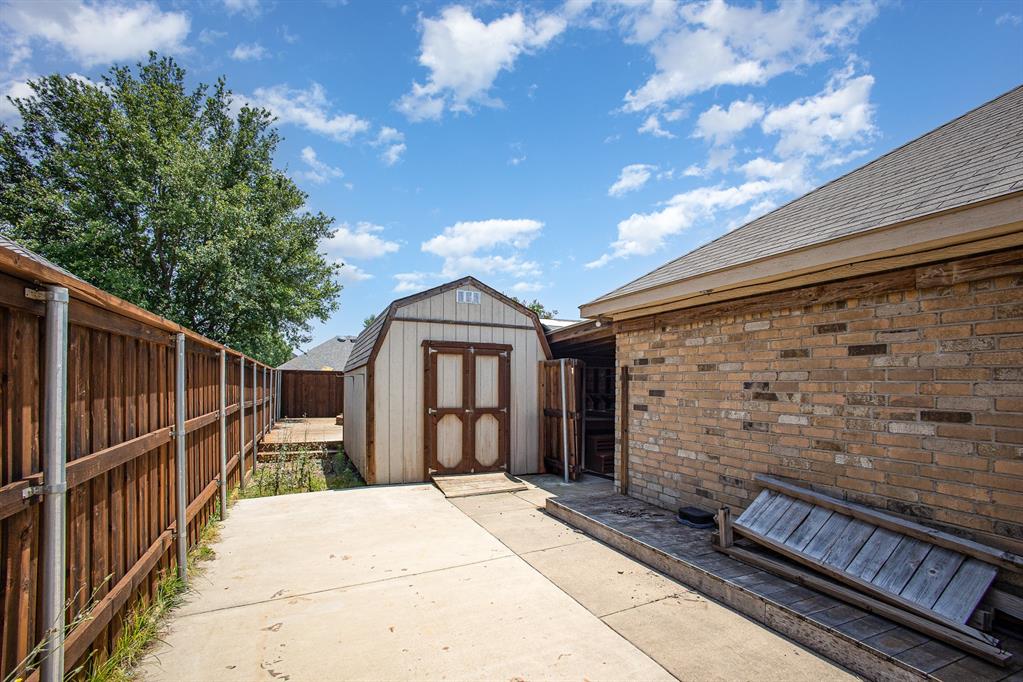 103 Hay Meadow Drive Crandall, TX 75114 - Photo 7 of 10 a front view of a house with a yard