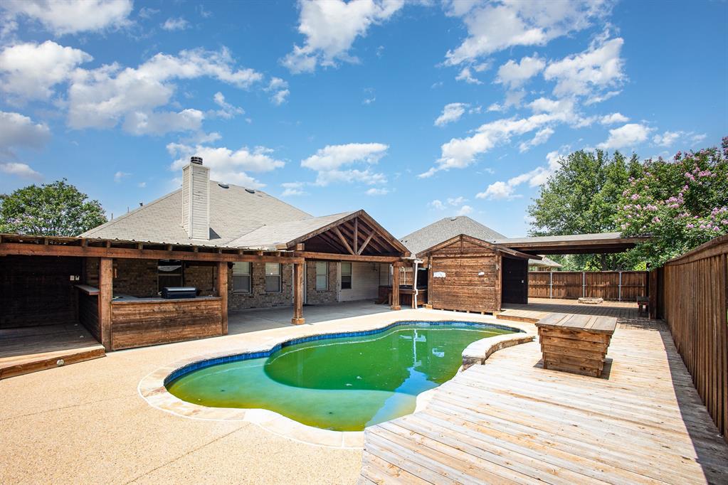 103 Hay Meadow Drive Crandall, TX 75114 - Photo 10 of 10 a front view of a house with a yard table and chairs