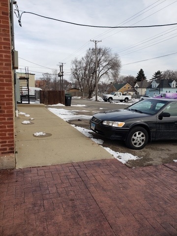 1132 27th Street Zion, IL 60099 - Photo 2 of 4 a view of a street with cars