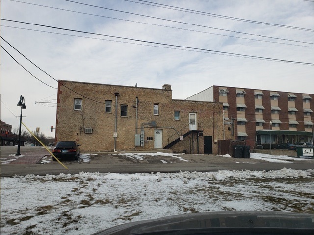 1132 27th Street Zion, IL 60099 - Photo 3 of 4 a view of a building with a road
