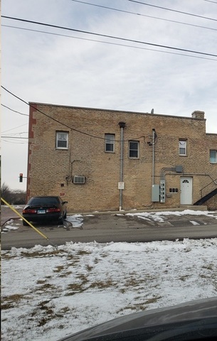 1132 27th Street Zion, IL 60099 - Photo 4 of 4 a bathroom with a sink and a mirror