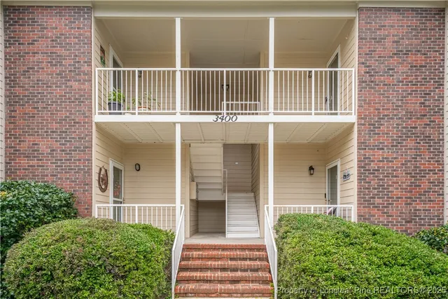a view of a house with porch and balcony