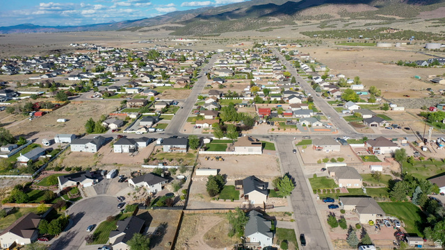 1797 Sunset Road Enoch, UT 84721 - Photo 71 of 80 Aerial overview of a residential area featuring a grid street pattern and scattered landscaping