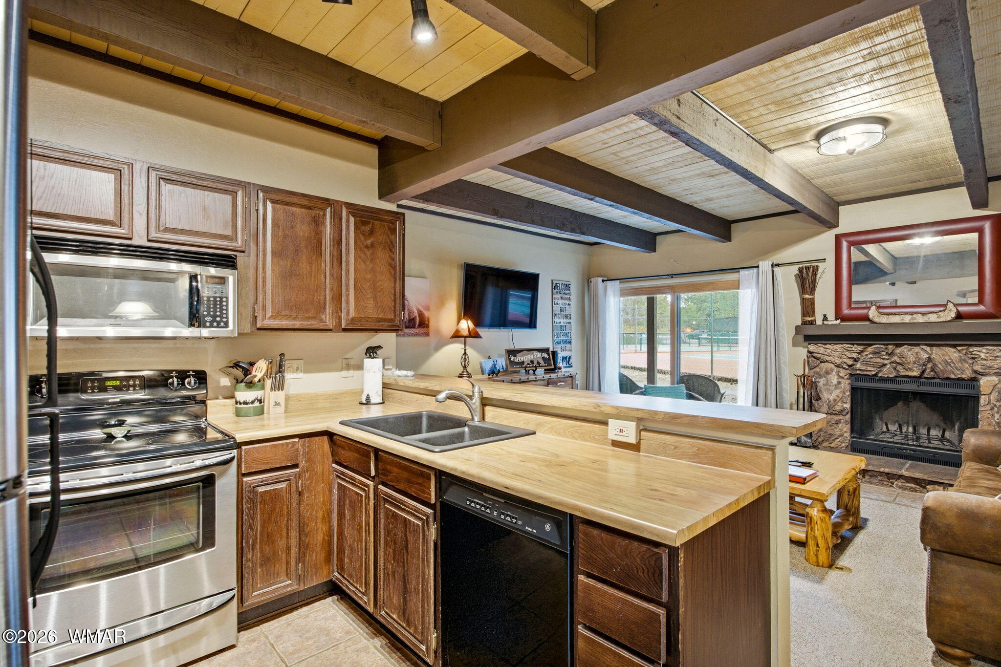 4563 Resort Loop Pinetop, AZ 85935 - Photo 11 of 21 a kitchen with a sink stove and microwave