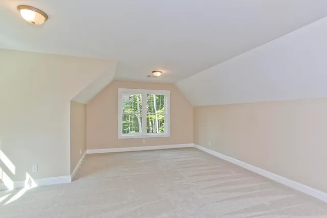 a bathroom with a granite countertop sink toilet and mirror