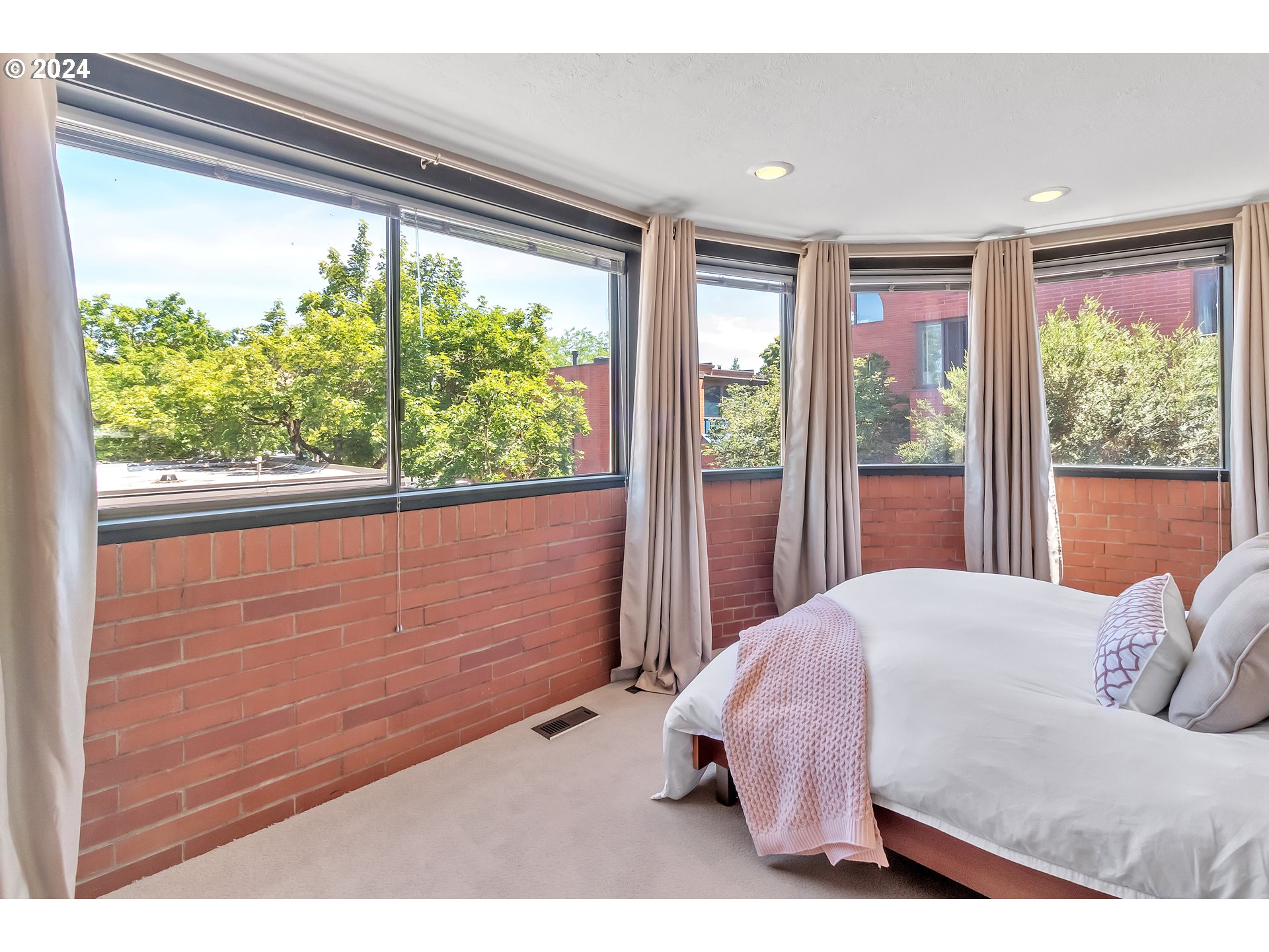 106 High Street Eugene, OR 97401 - Photo 11 of 46 a bed sitting in a bedroom next to a window