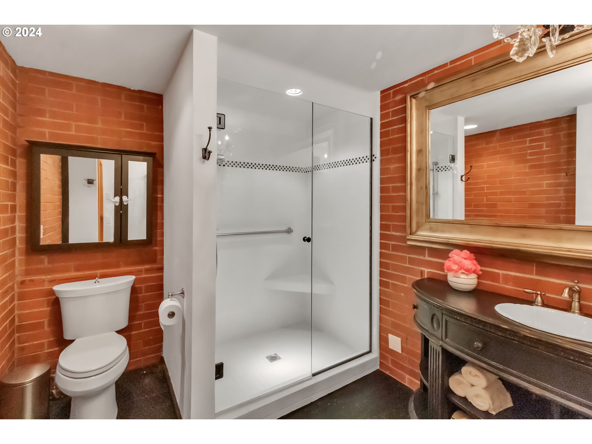 106 High Street Eugene, OR 97401 - Photo 8 of 46 a bathroom with a toilet sink and shower