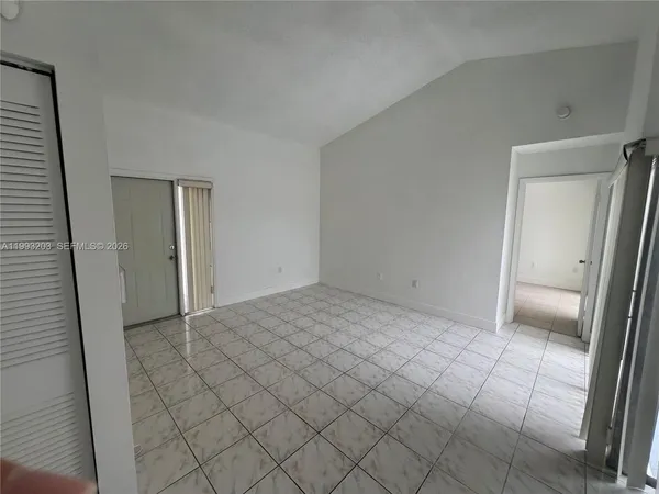 an empty room with a bench