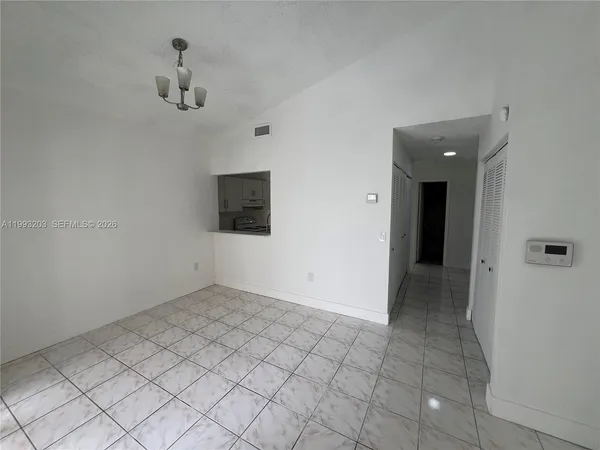 a view of an empty room with a bathroom