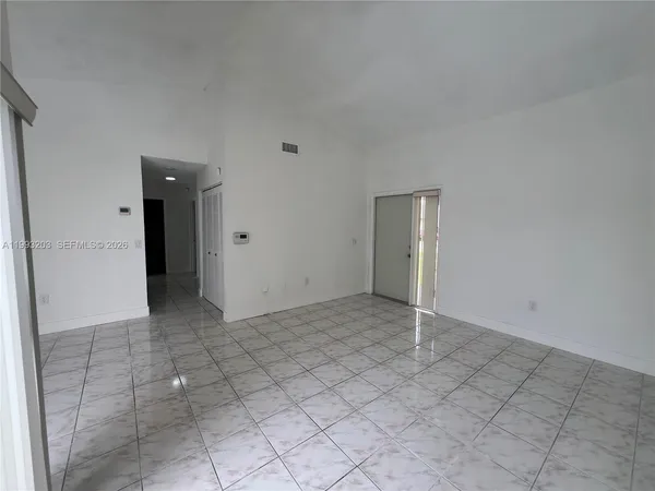 an empty room with entrance and door