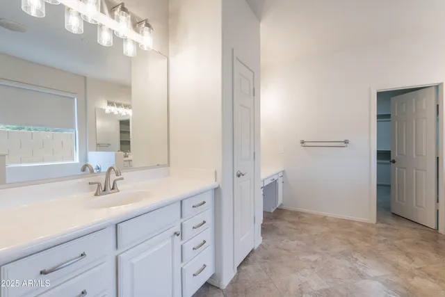 a bathroom with a sink double vanity and a mirror