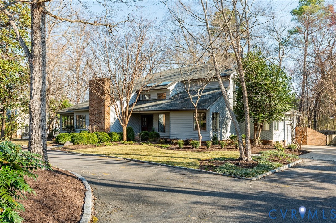 9306 South Mooreland Road Henrico, VA 23229 - Photo 1 of 59 Traditional-style house with driveway and a chimne