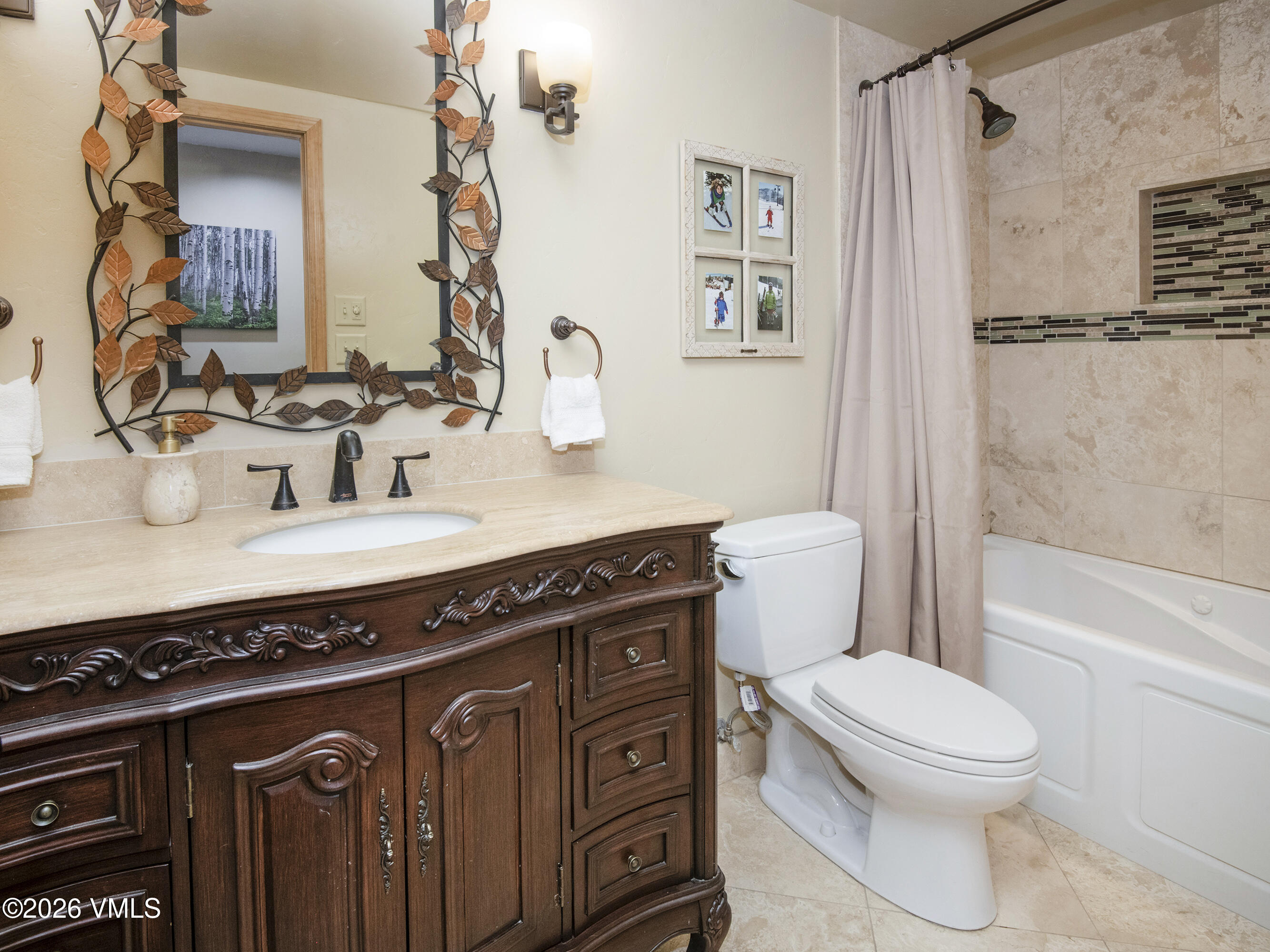 1650 Fall Ridge Road, Unit 202 Vail, CO 81657 - Photo 15 of 32 a bathroom with a granite countertop toilet sink and mirror