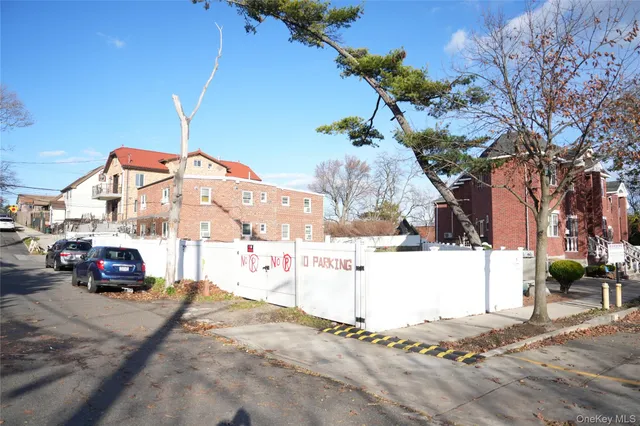 a view of building with car parked